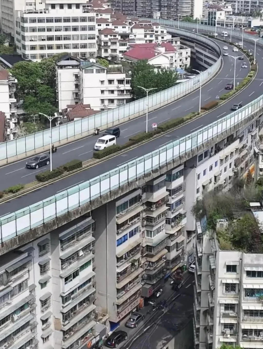 highway-built-over-houses-in-china-v0-mk9l2j8urqvd1.webp