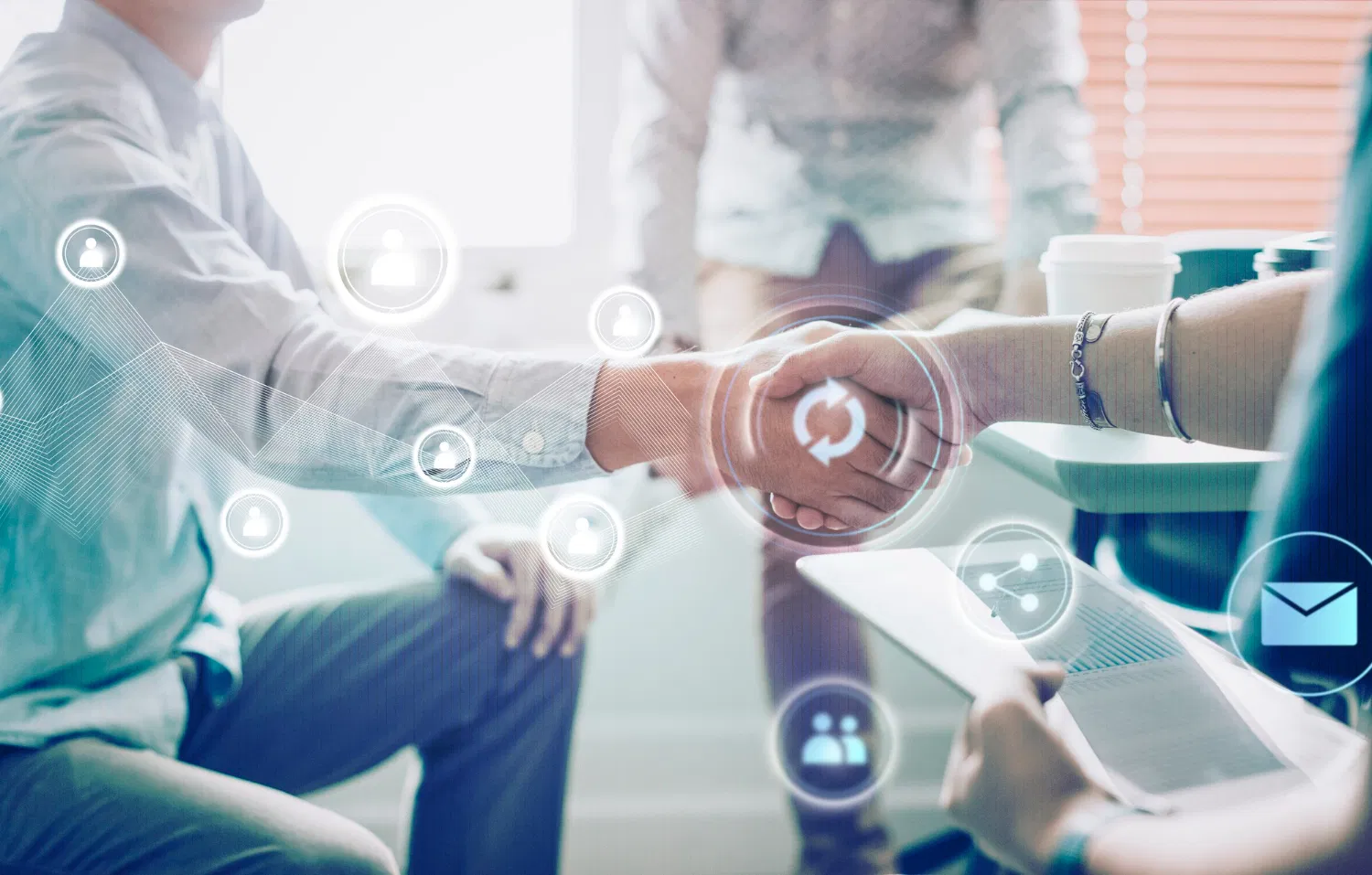 Handshake between professionals with digital marketing icons overlay, WaveMed promotional materials for representatives