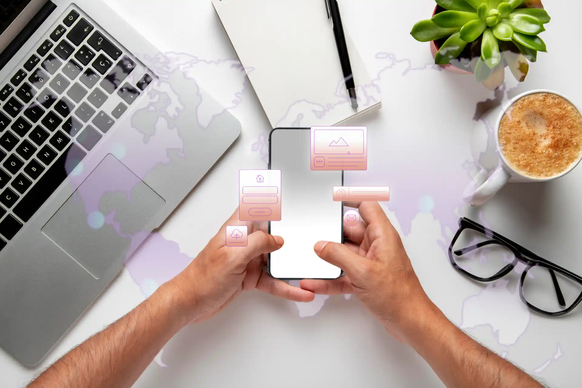 WaveMed materialy cyfrowe: rece trzymajace smartfon z ikonami UI na biurku z laptopem, kawe i notatnikiem, symbol cyfrowej komunikacji.