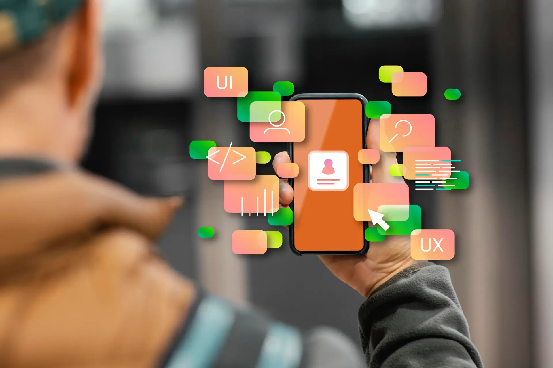 WaveMed opracowuje tresci na strone www; osoba trzymajaca telefon z ikonami UX i UI symbolizuje tworzenie intuicyjnych rozwiazan cyfrowych