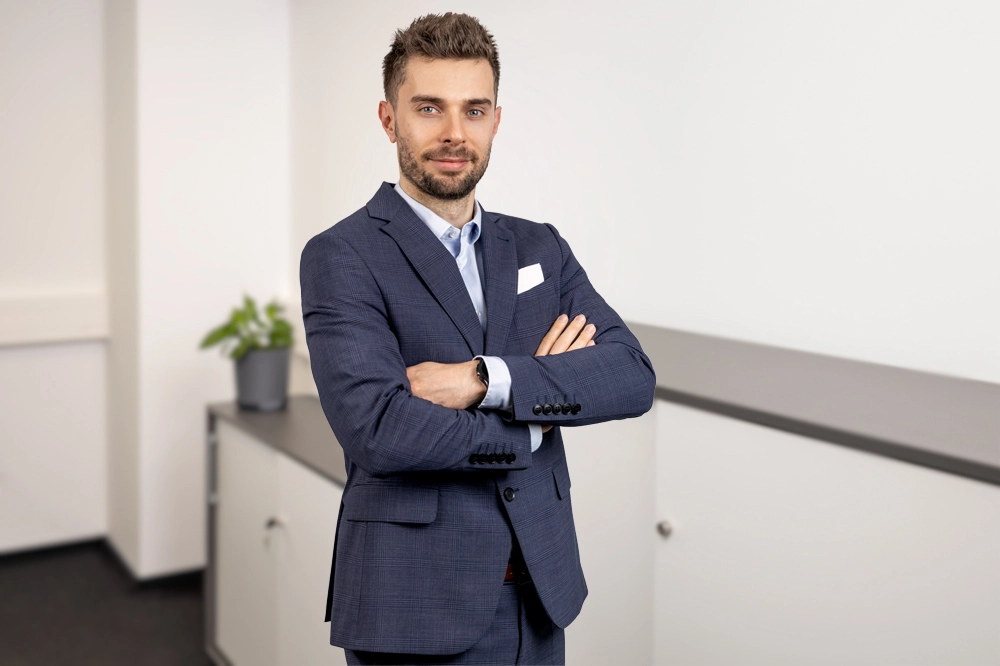 WaveMed co-founder standing in an office and presenting a professional portrait with arms crossed