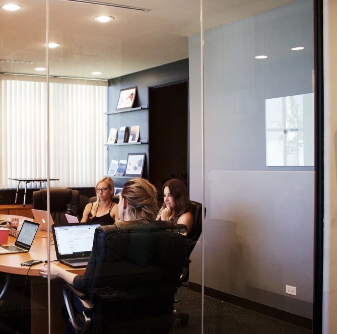 Team working together during a project meeting, collaborating on solutions at the WaveMed medical communications agency