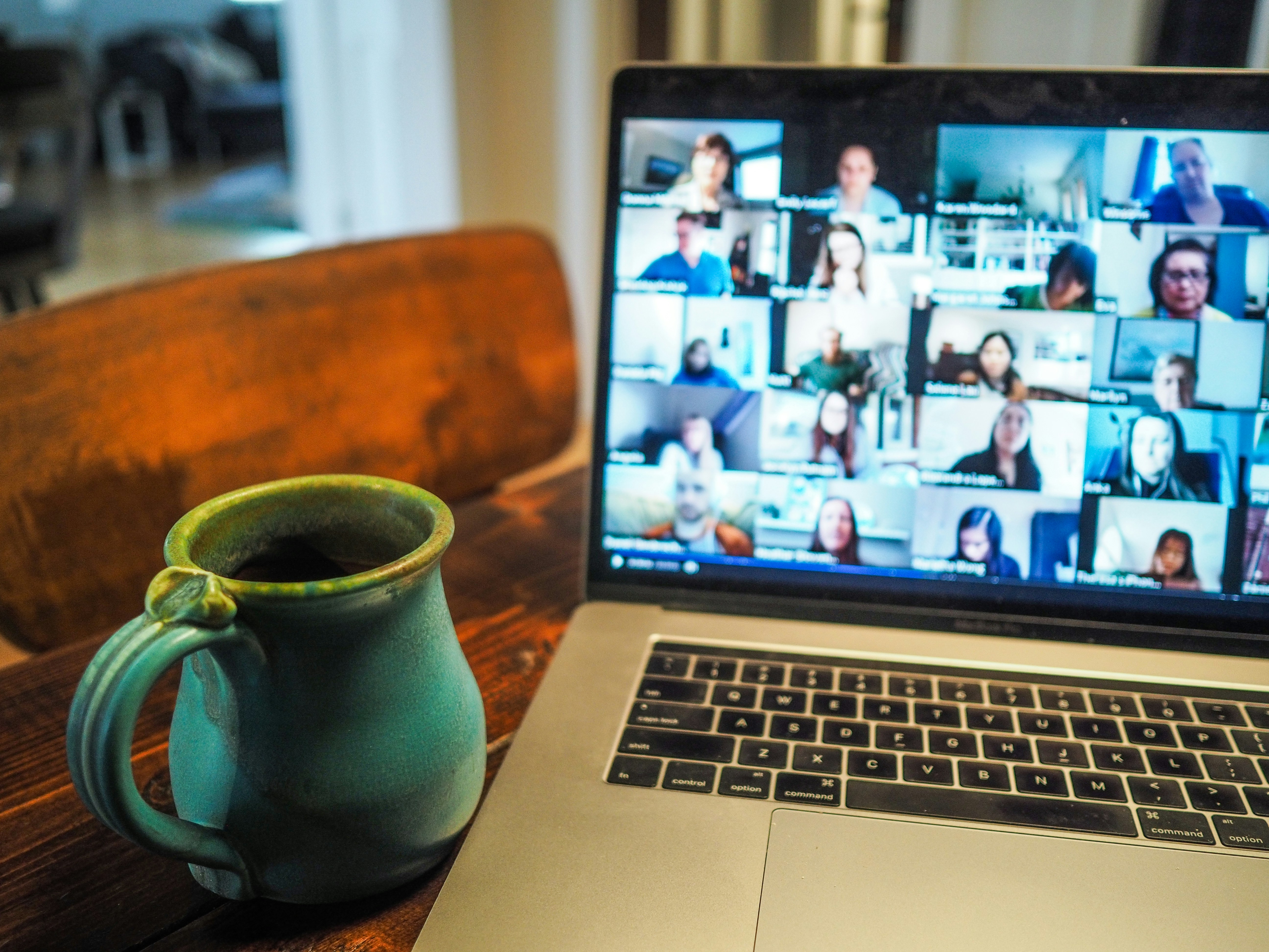 Online WaveMed team meeting displayed on a laptop next to a mug, symbolizing collaboration in medical communications