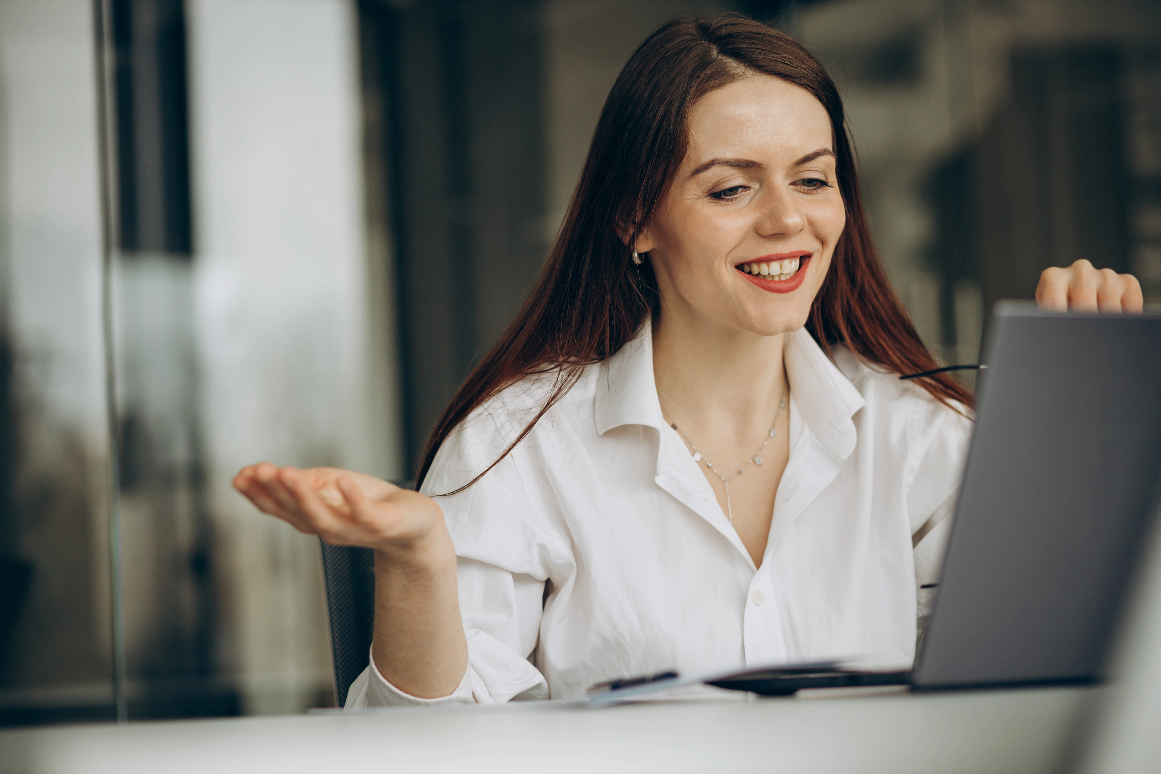 Smiling woman during an online meeting creating digital materials — concept of promotional toolkit development by WaveMed Medical Comms