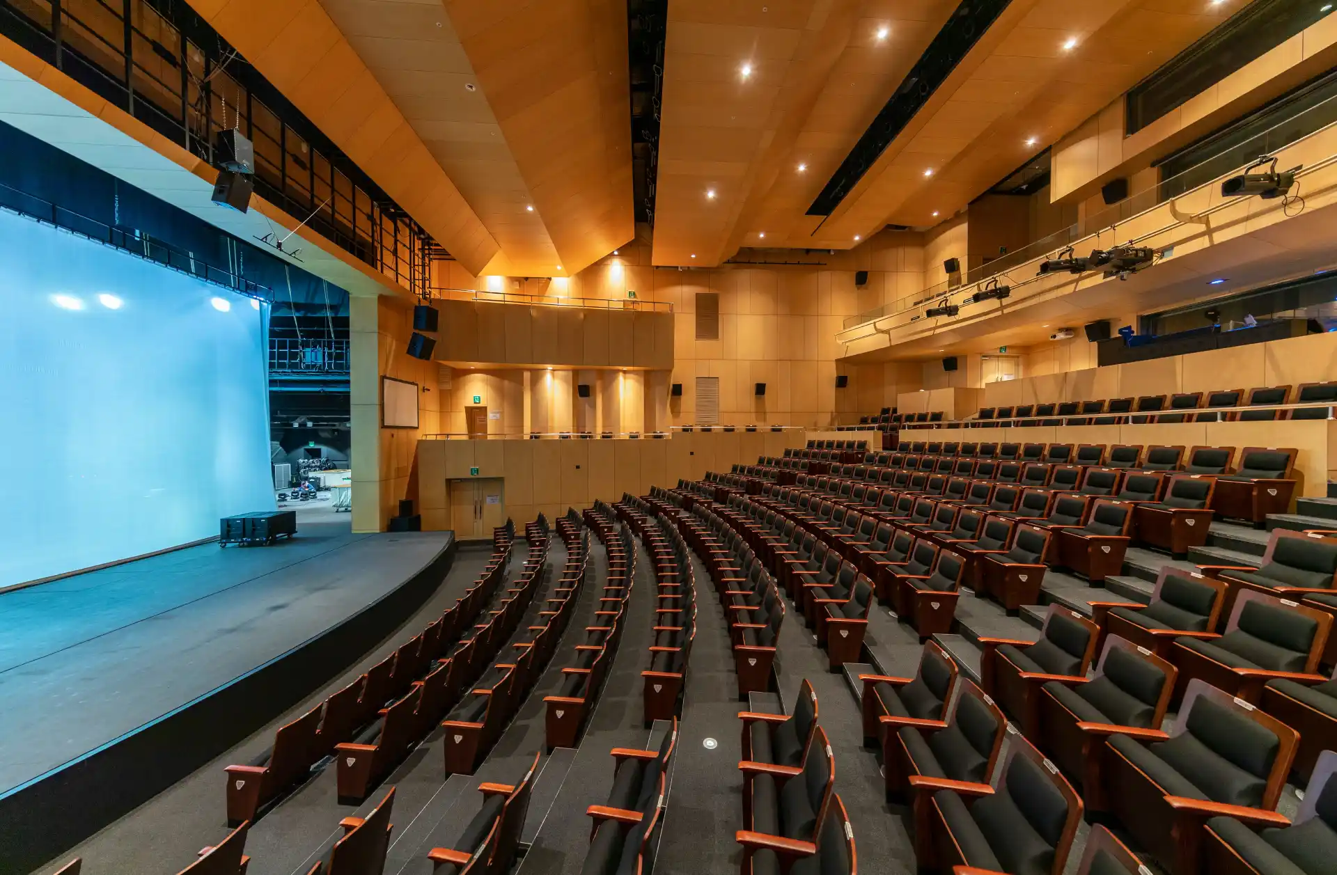 Large auditorium prepared for educational meetings by WaveMed agency