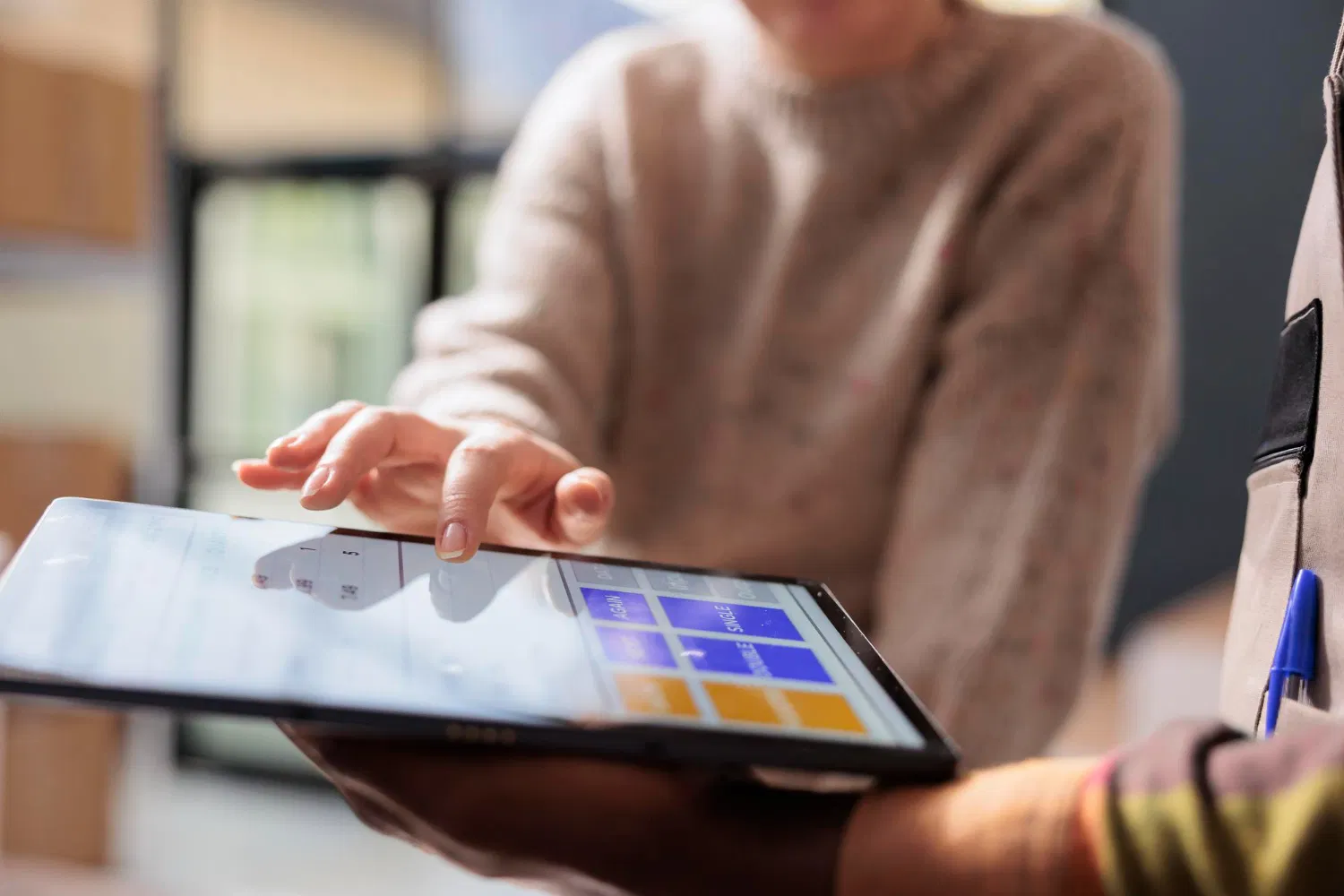 Person using a tablet to access an interactive educational module of the course created by WaveMed agency