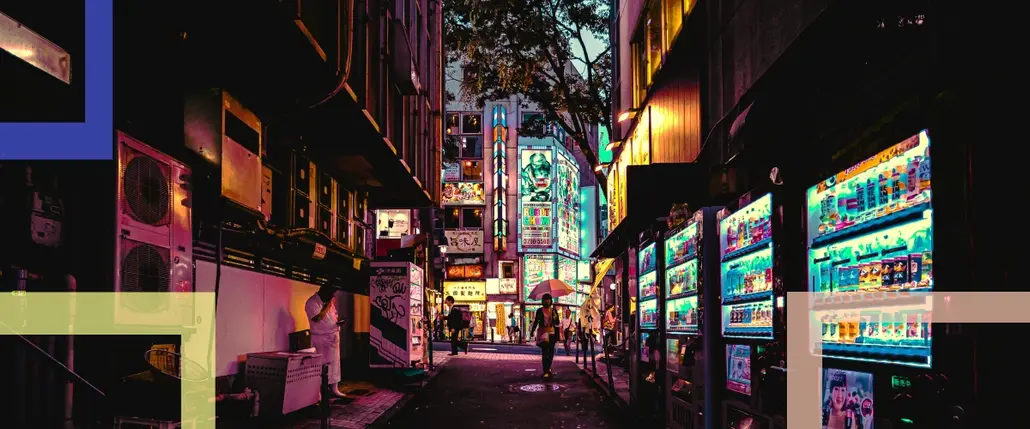 A photo of a city and an alley with vending machines