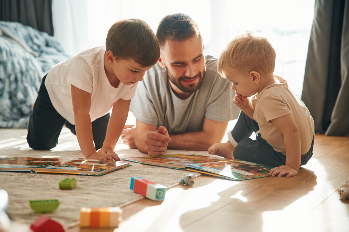 lying-down-board-game-father-is-playing-with-two-web.jpg