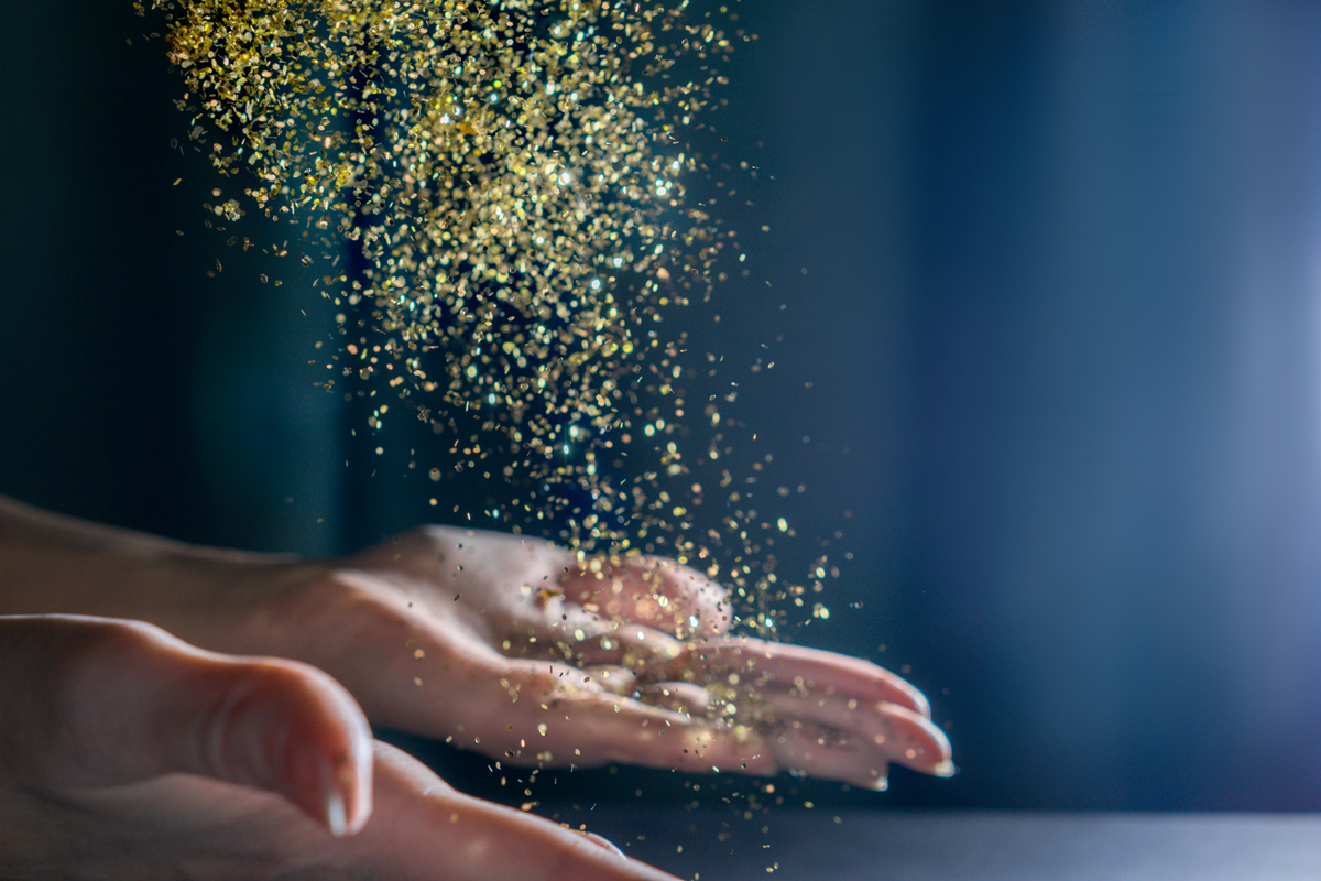 hands-with-flying-sequins-light-back-2023-11-27-04-50-23-utc.jpg