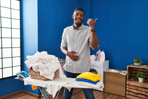 depositphotos_644127966-stock-photo-african-american-man-ironing-clothes.webp