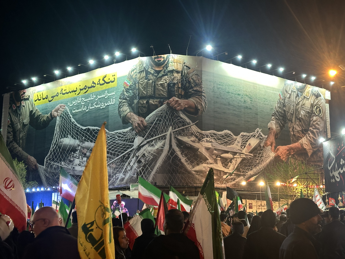 Enghelab Square on night 36 of the rallies. The banner reads: “The Strait of Hormuz will remain closed. The entire Persian Gulf is our hunting ground.”