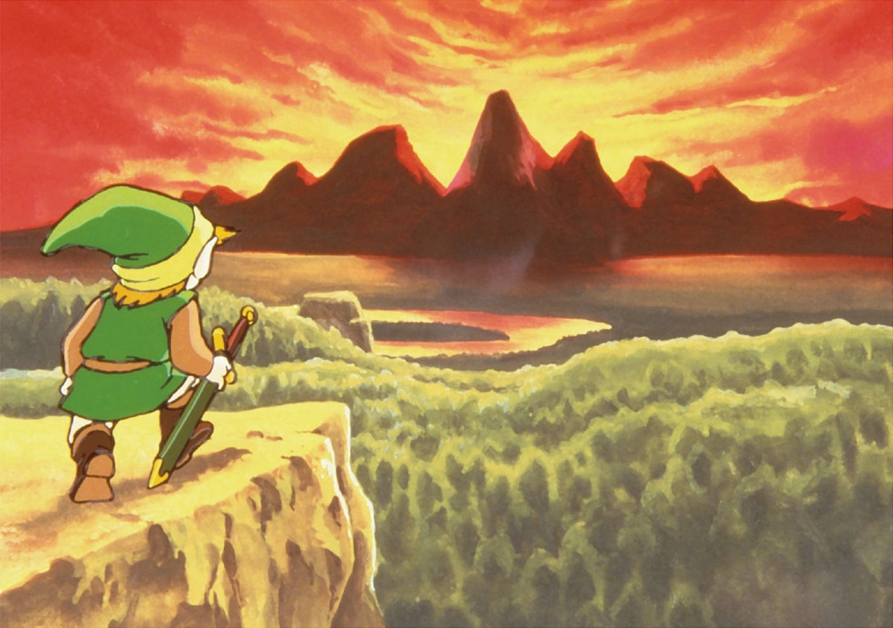 Link fra The Legend of Zelda står på kanten av et stup med sverd i hånd og ser utover landskap i solnedgang