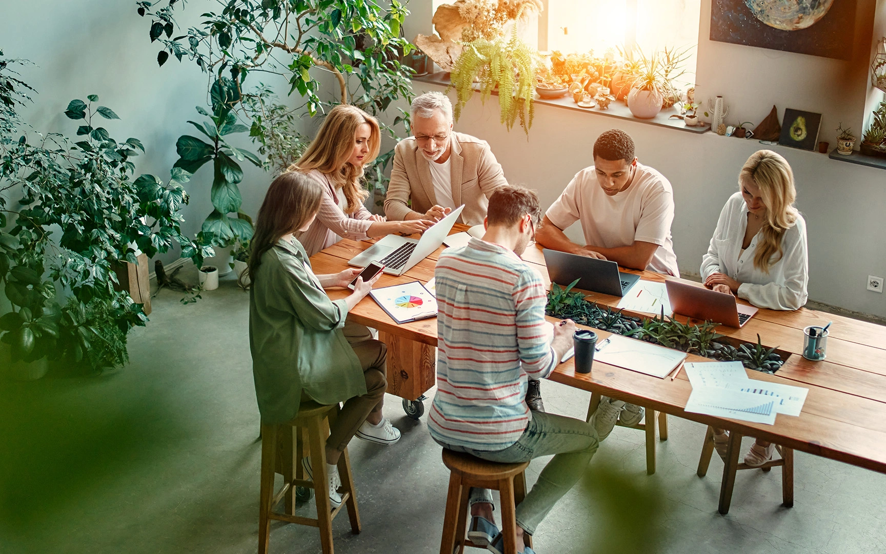 people working around table 