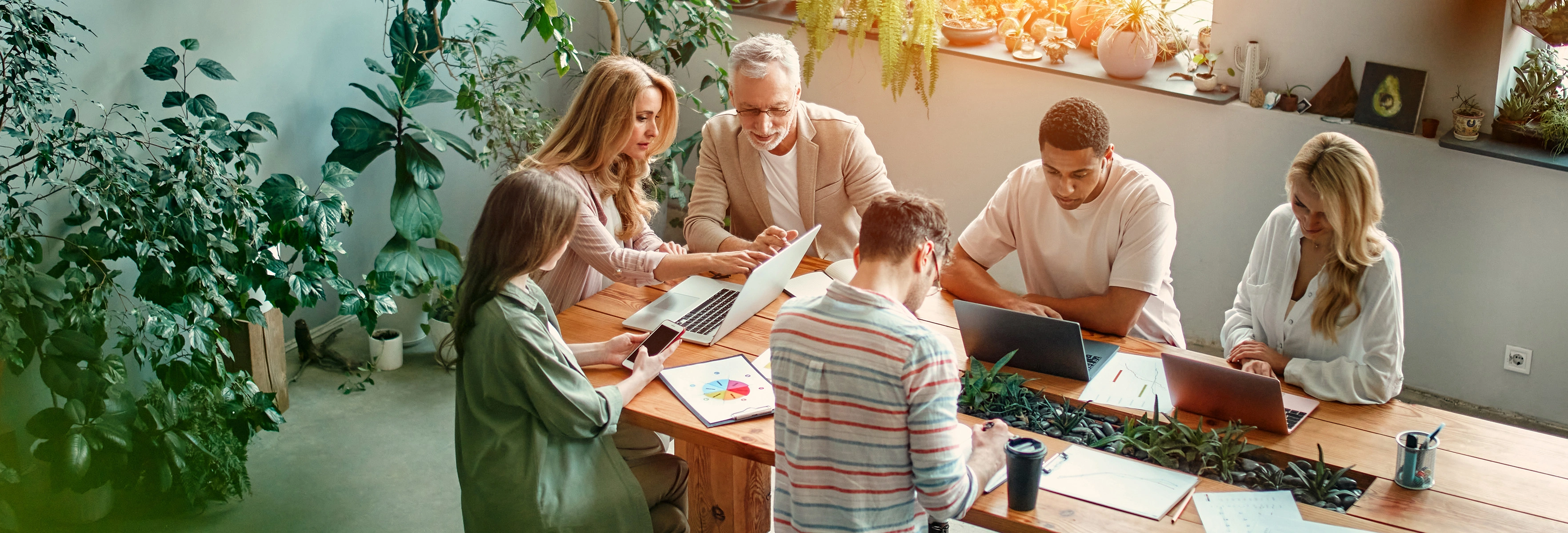 people working around table 