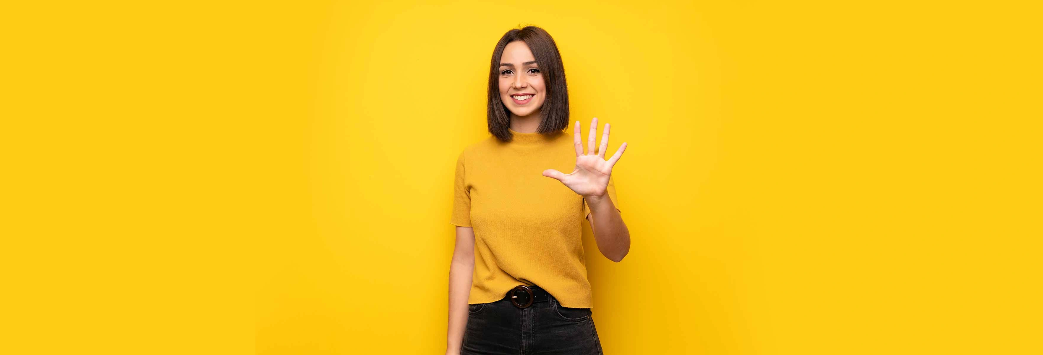 Young woman holding out her hand to represent 5 things