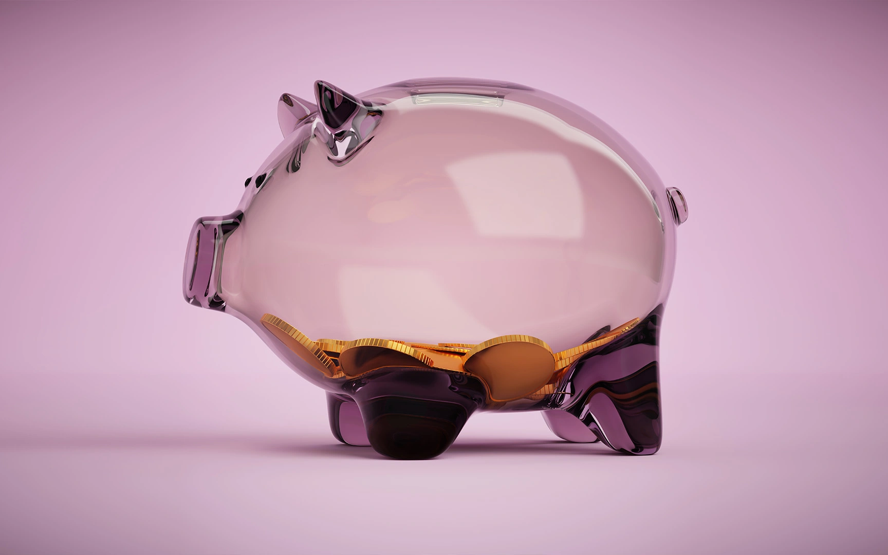 transparent piggy bank with coins