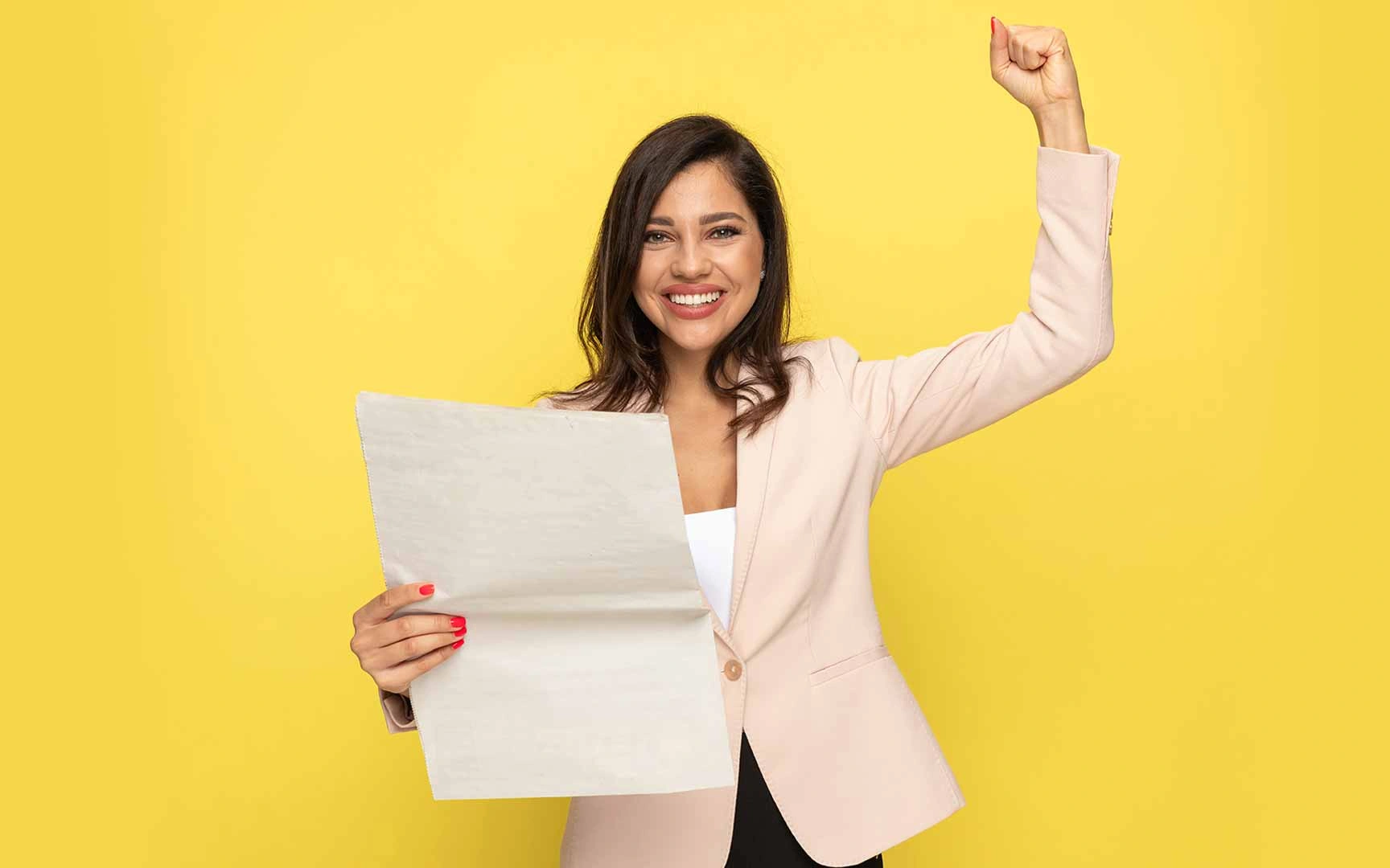 person with paper on yellow background