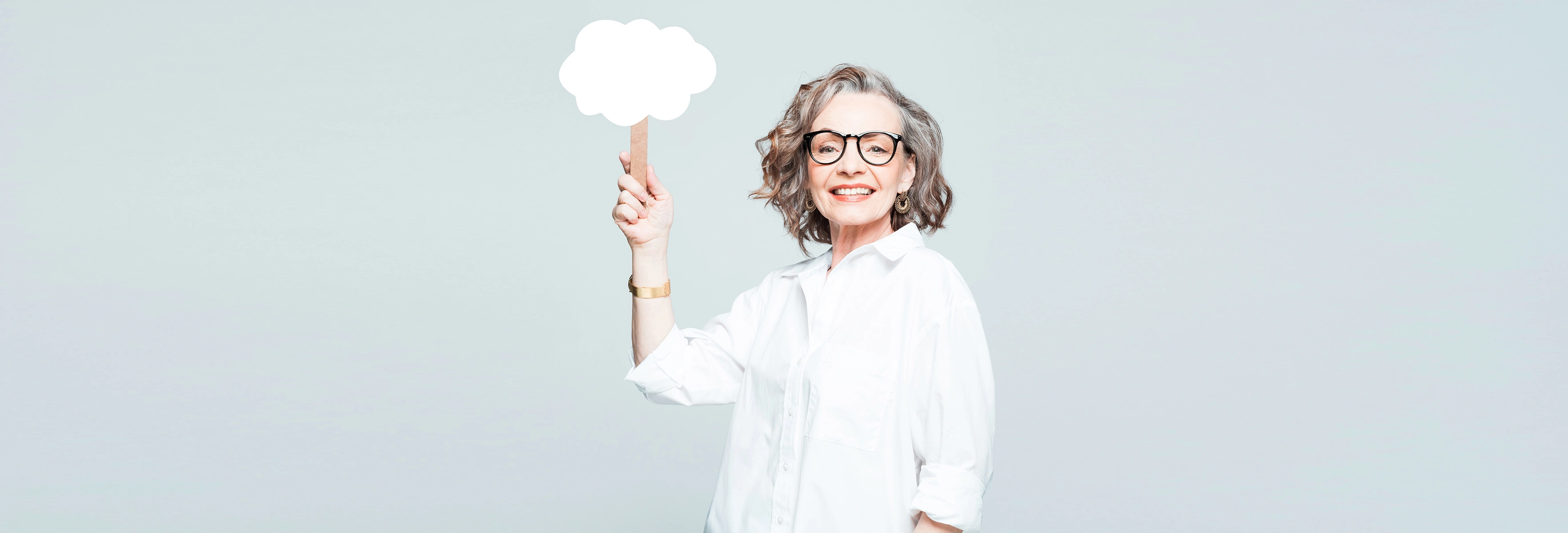 woman holding up cloud sign