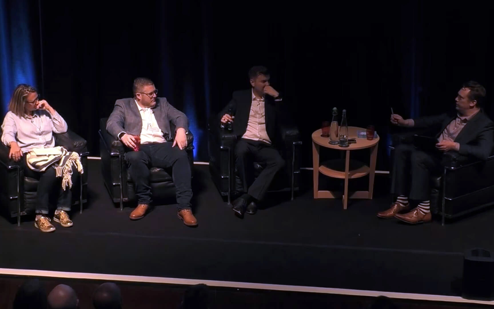 people speaking in a conference