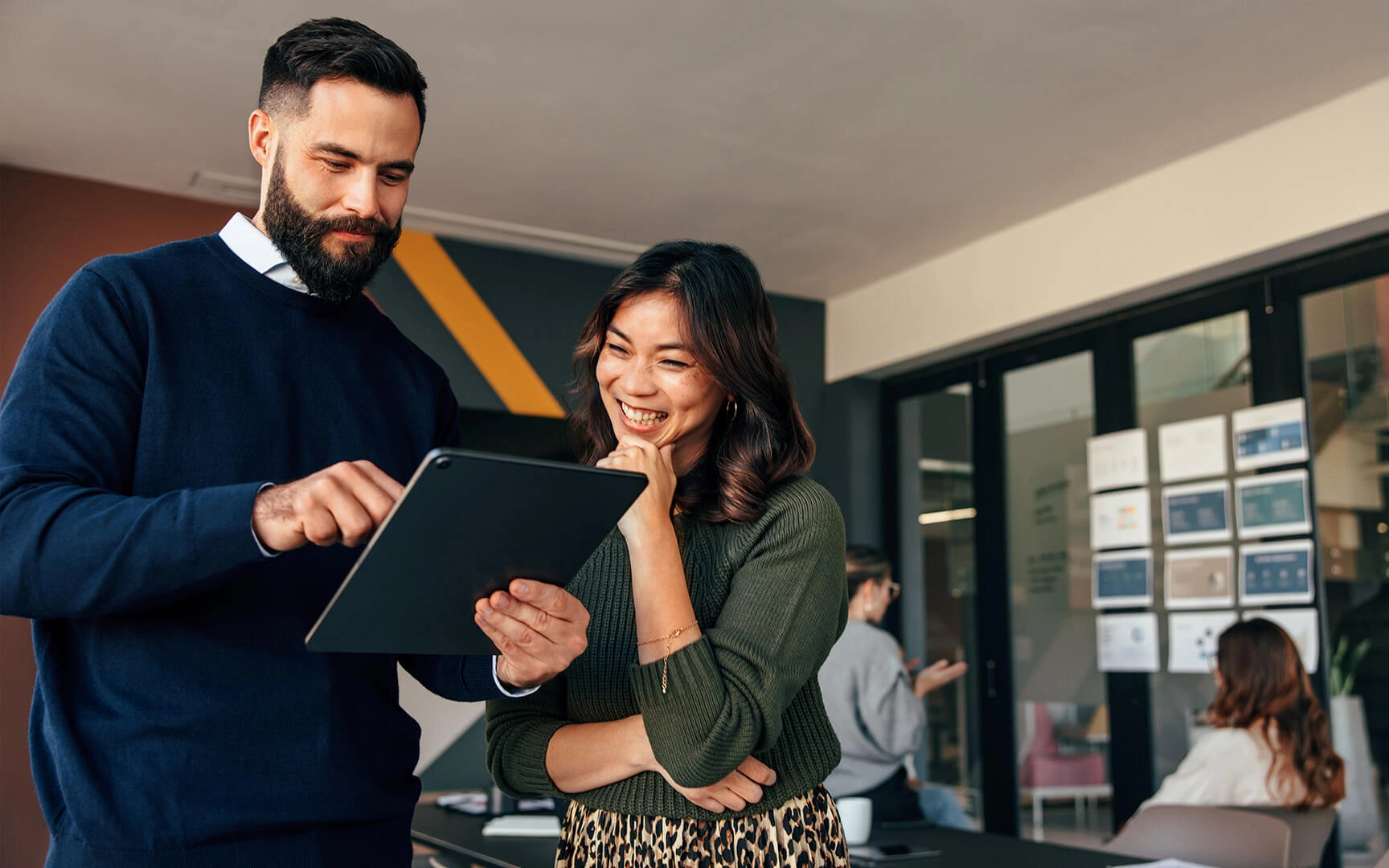 couple looking at tablet