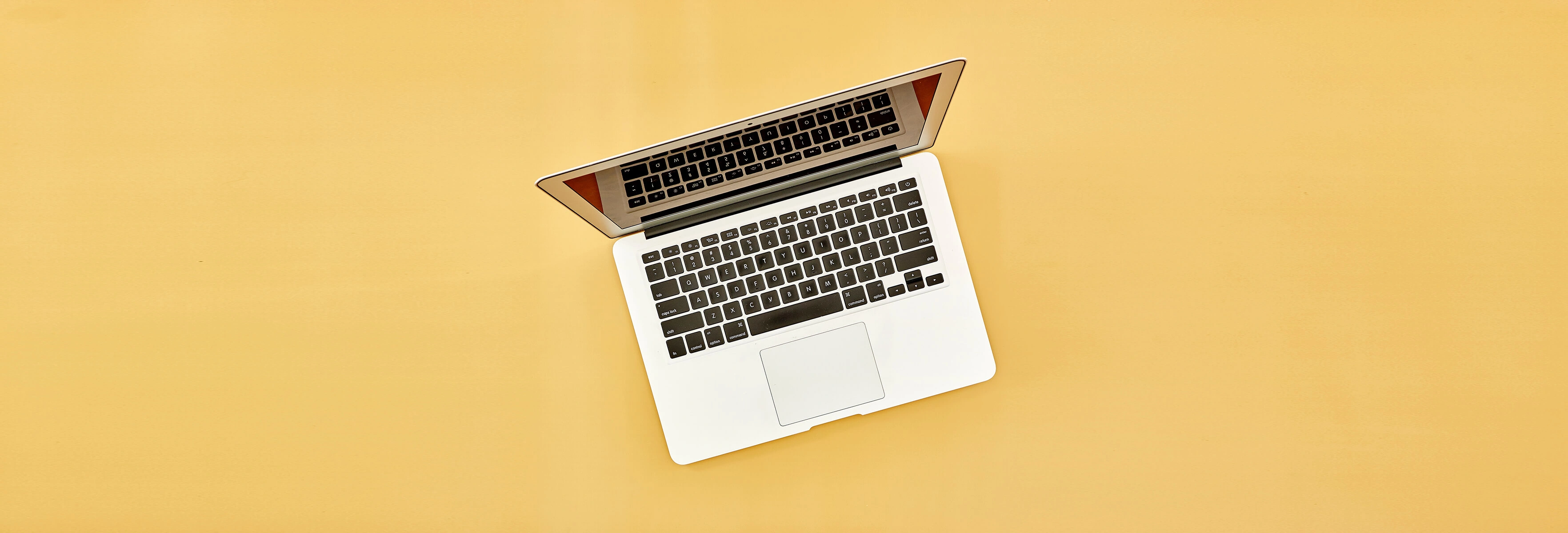 laptop on orange background