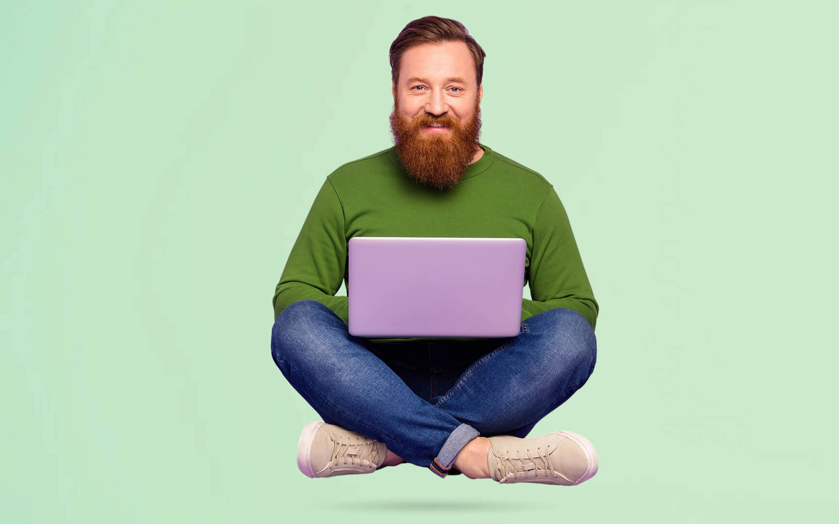 men with a laptop flying and smiling