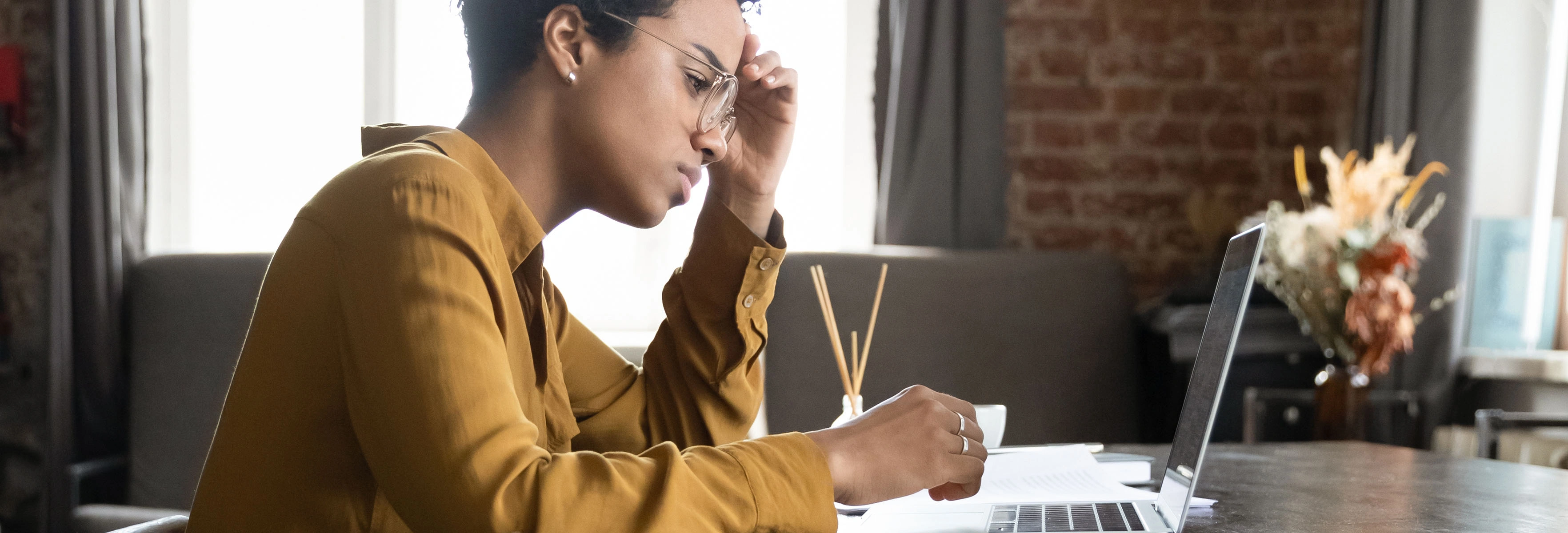 Woman looking at laptop