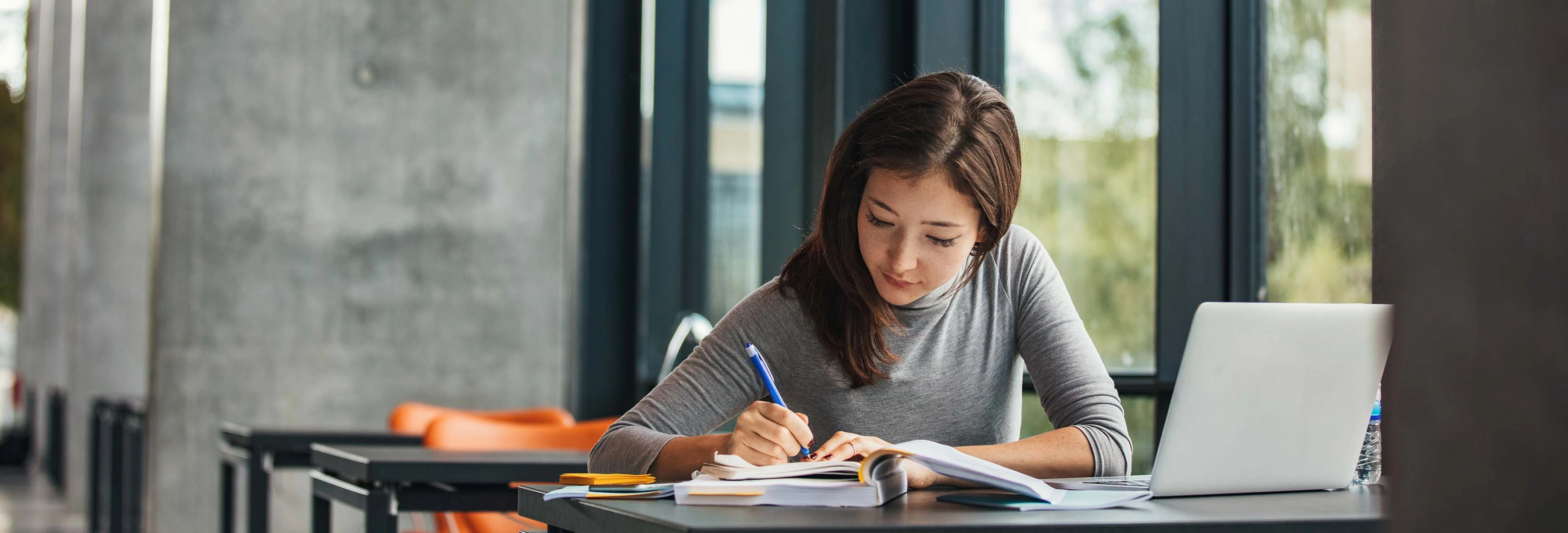 person studying with laptop