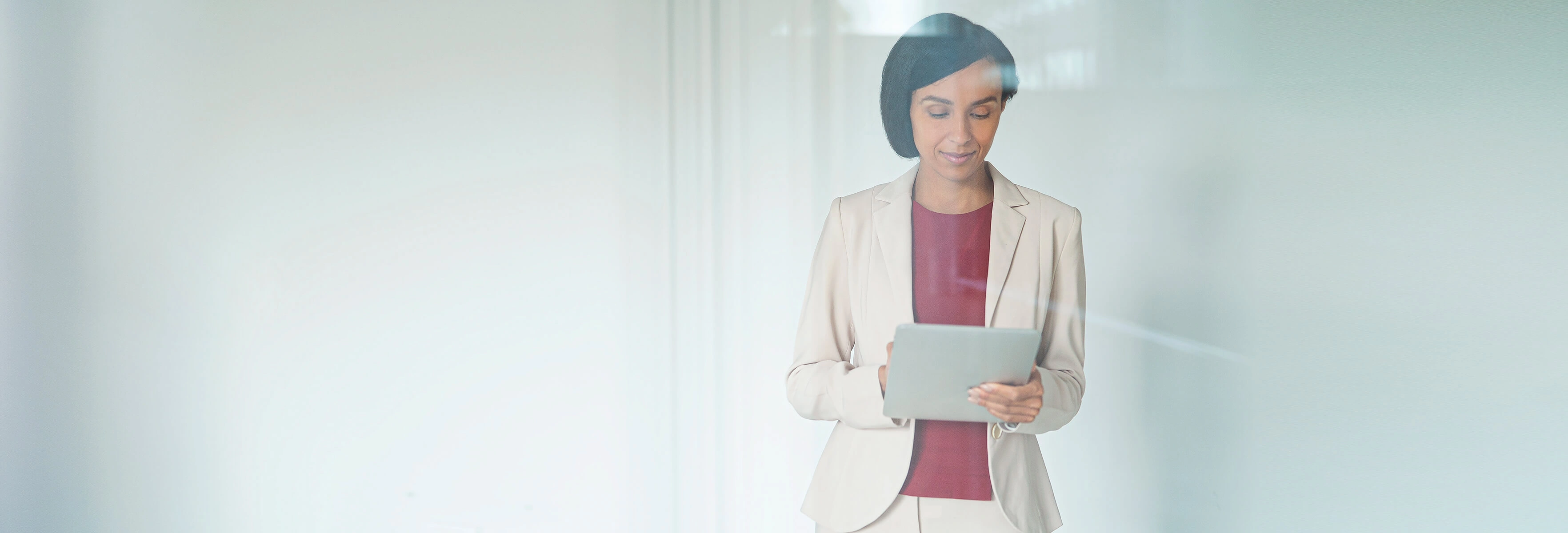 Smart dressed women holding a tablet