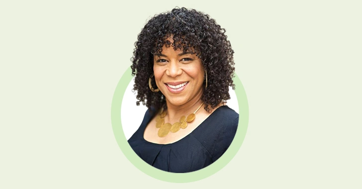 Portrait of Jennifer Sherman, Unit4's Chief Product Officer, smiling with curly hair, wearing a black top and a gold necklace, set against a light green circle and a beige background.