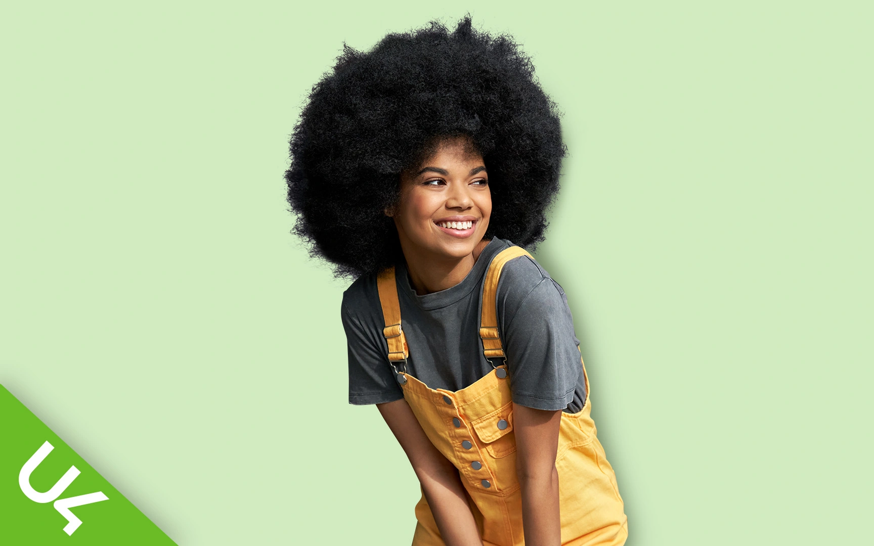 Smiling woman in yellow dungarees