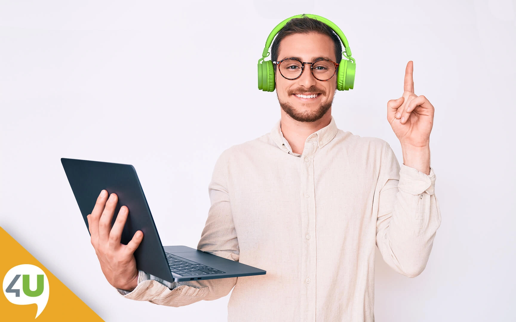 Smiling man with headphones and laptop