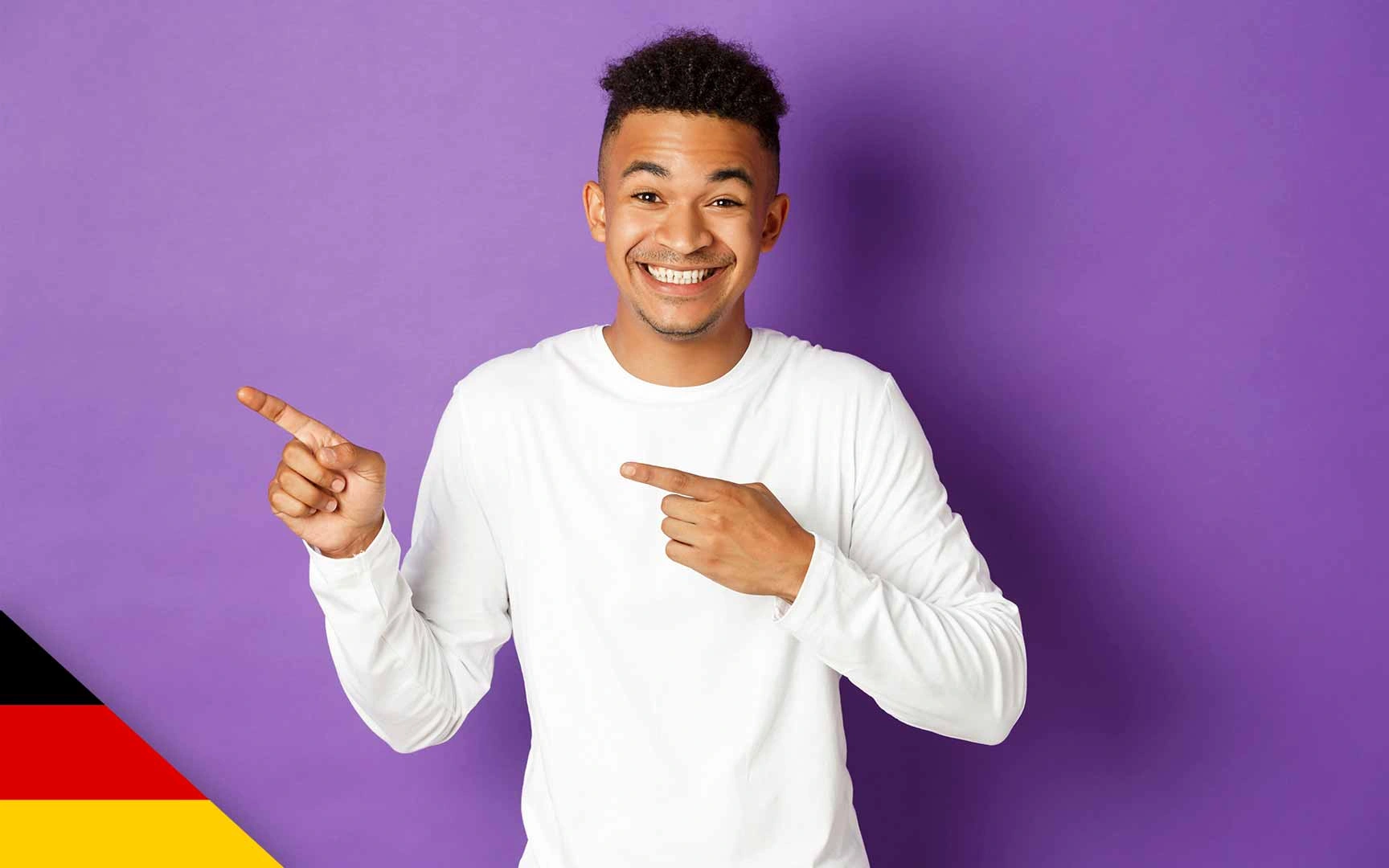 Man smiling and pointing to left