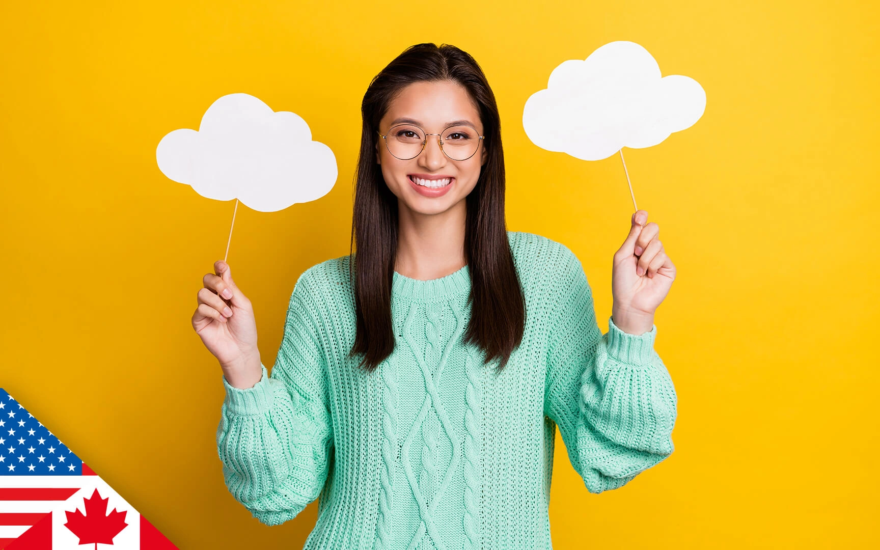 Smiling woman with both arms half raised and holding up cardboard cut-out clouds