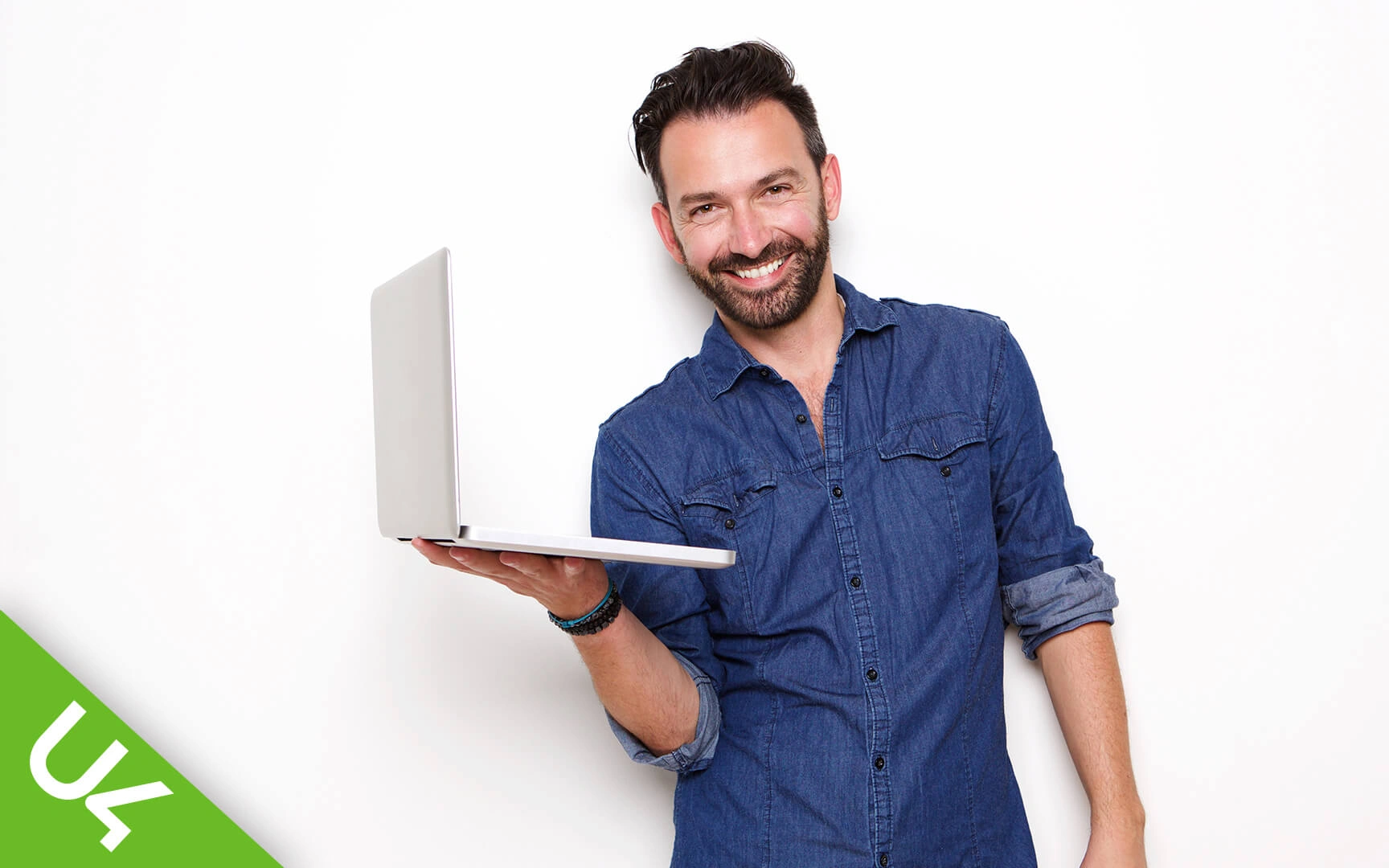 Smiling man with laptop