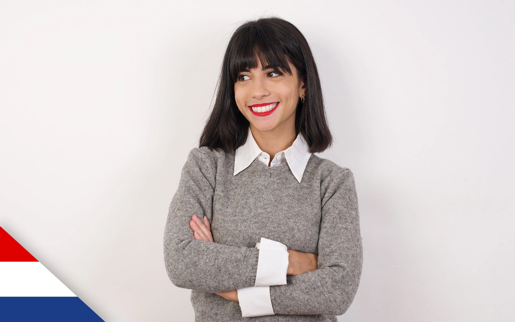 Smiling woman with arms folded