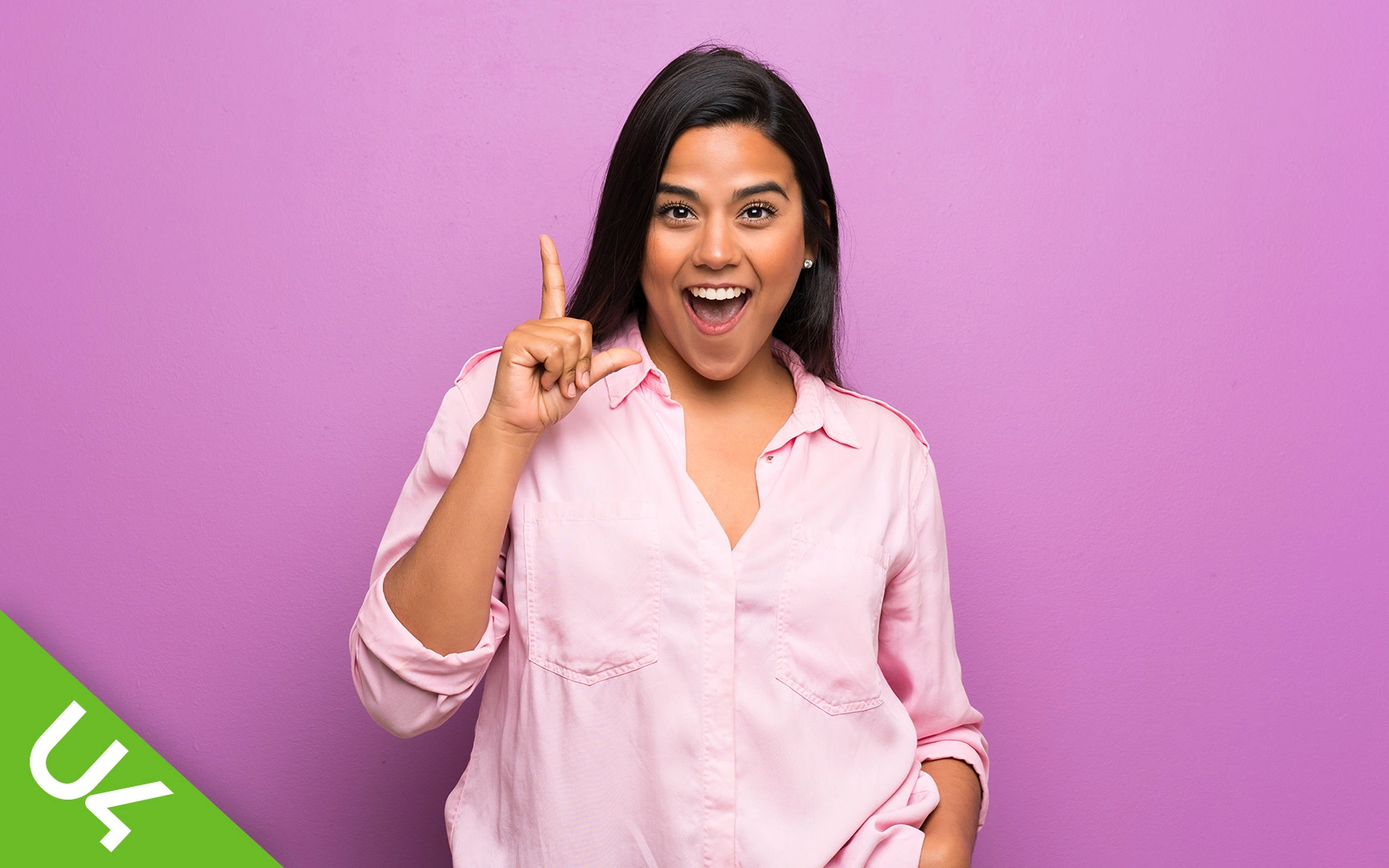 Laughing woman in light pink blouse