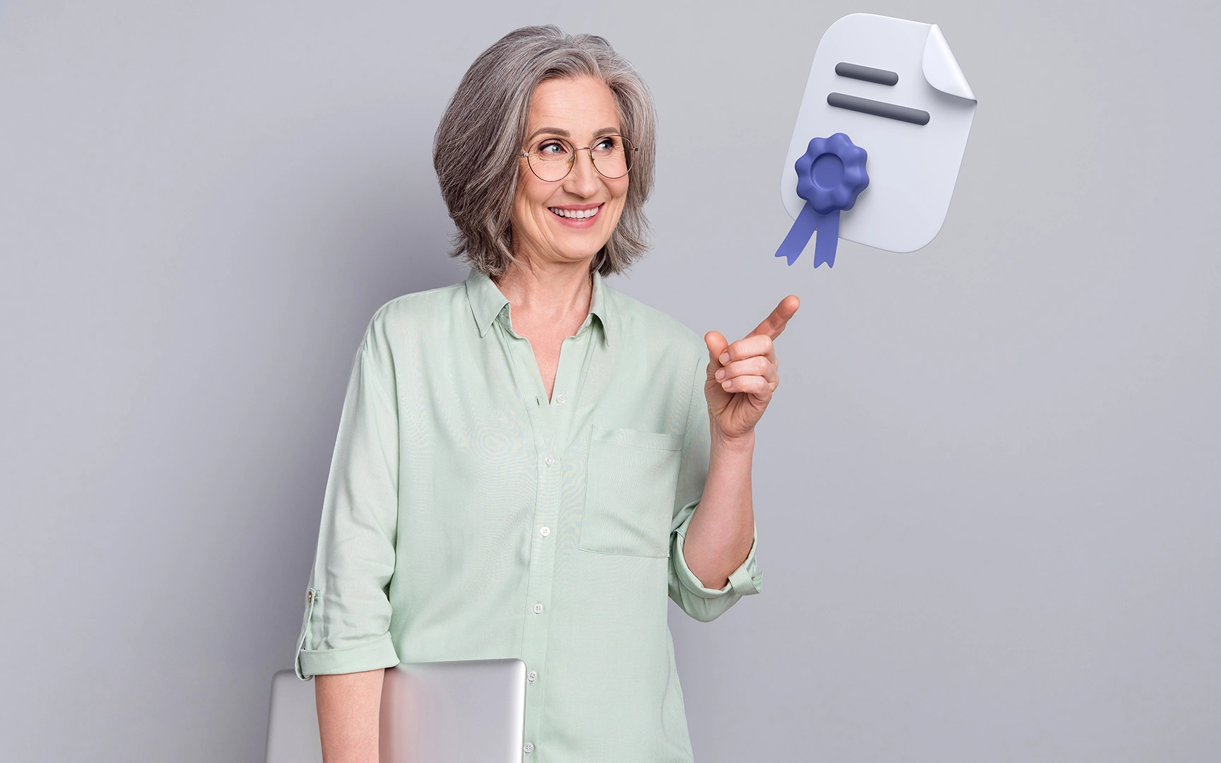 woman pointing to a diploma