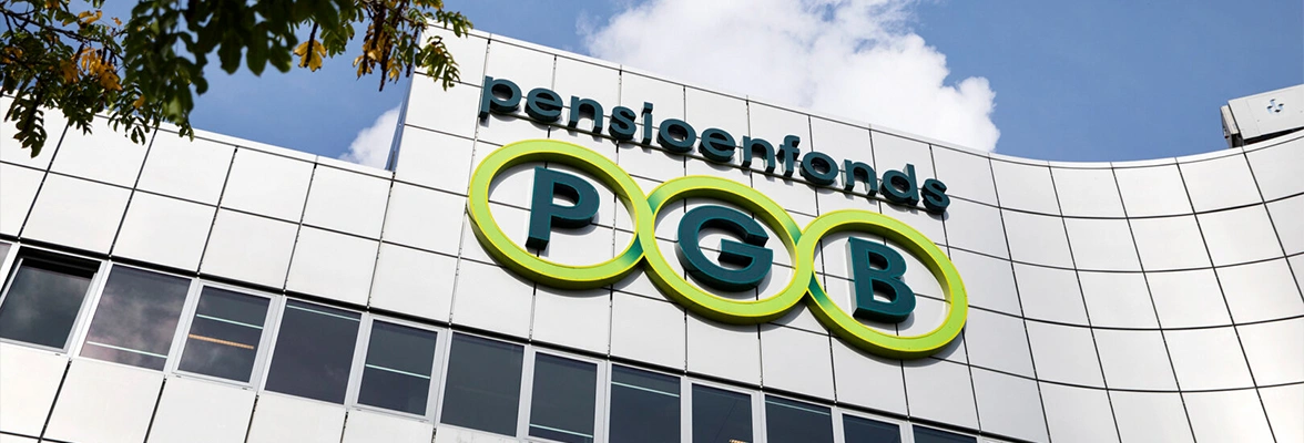 Exterior view of the PGB Pensioendiensten office building with the PGB logo prominently displayed on a modern glass and metal façade.